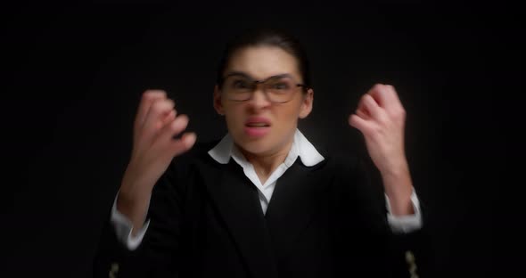 Enraged Business Woman Gets Angry Brings Her Twisted Hands to Her Face in Anger