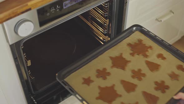 Top view of Baking Christmas Gingerbread cookies in the oven Cooking in the oven