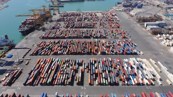 Colorful containers in barcelona port warehouse aerial shot
