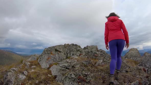 Adventurous Girl Hiking Up Nares Mountain alt