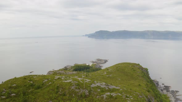 Calm Water Of Stadhavet Sea With Skongenes Lighthouse On Tip Of Vagsoy Island In Vestland, Norway. - alt