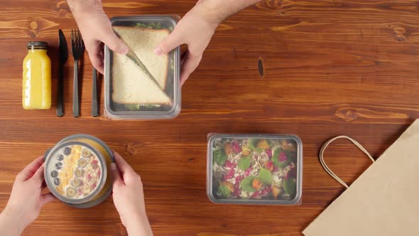 Food Delivery Top View Take Away Meals in Disposable Containers on Wooden Table alt