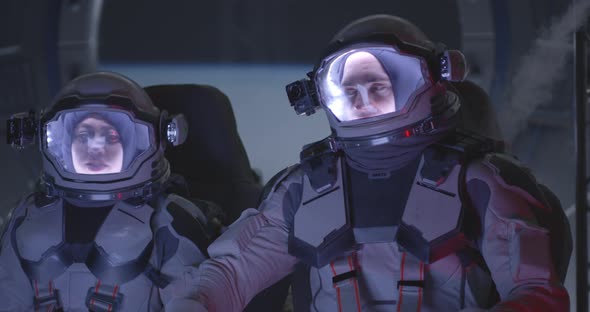 Astronaut Sitting in Accelerating Spaceship alt