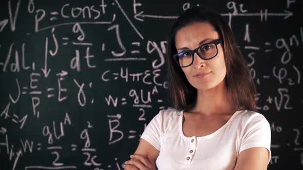 Beautiful Brunette Woman Posing Over School Board With Math Formulas.