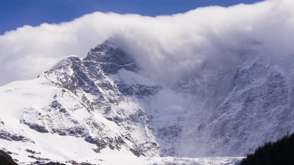 Timelapse of dissolving foehn clouds at Fiescherwand in Switzerland alt