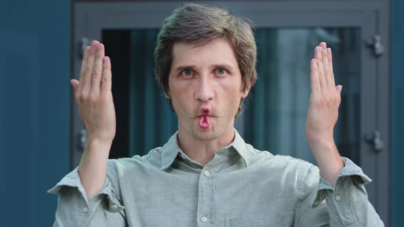 Smiling Happy Millennial Professional Businessman Looking at Camera Have Fun Make Funny Ridiculous alt