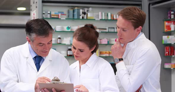 Senior Pharmacist Talking with Junior Staff alt