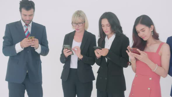Business young asian man and woman looking smartphone to social network. alt