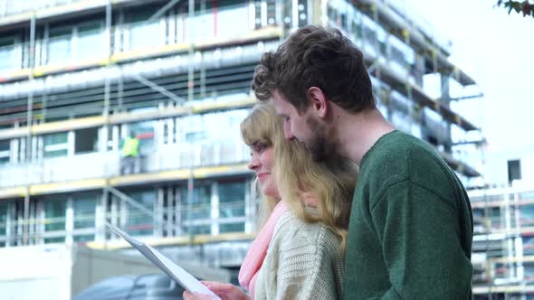 Couple on Front of New House  alt