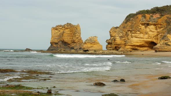 Limestone rock formations at an Australian coastal beach. WIDE SHOT. STATIC SHOT. alt