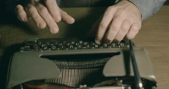 Businessman typing on a vintage typewriter