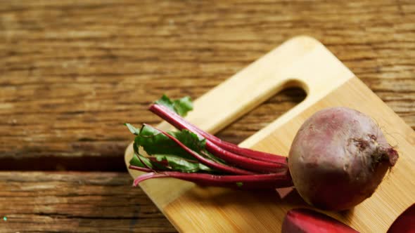 Raw beetroot on chopping board 4k alt