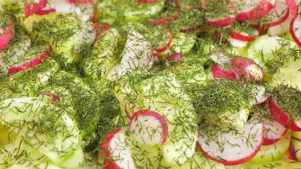 Close Up Salad of Radishes Cucumbers Cabbage Sprinkled with Dill alt