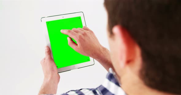 Man using digital tablet alt