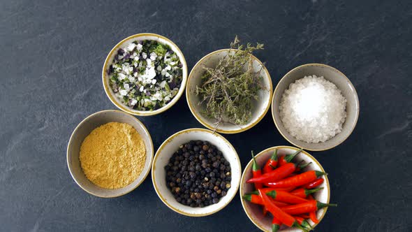 Bowls with Different Spices on Wooden Table 21 alt