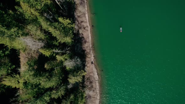 Peaceful Fishing Overhead Aerial On Calm Lake In Pacific Northwest Forest