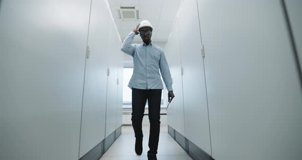 An Engineer Puts on a Helmet alt