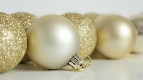Matte color Christmas bauble close-up 4K tilting footage alt