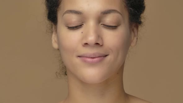 Beauty Portrait Young African American Woman is Relaxing Closing Eyes Calming Down and Breathing alt
