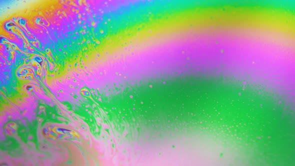 Bubbles Swirling in Rainbow Liquid Colors. Dreamy Hypnotic Abstract Background alt