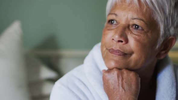 Close up of senior mixed race woman at home in thought alt