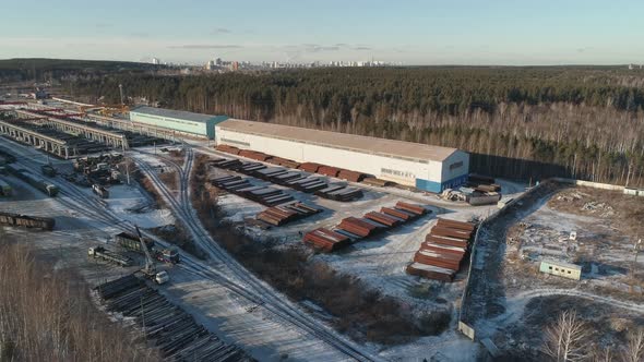 Round metal pipes in Metal warehouse. The locomotive rides on the railroad 05 alt