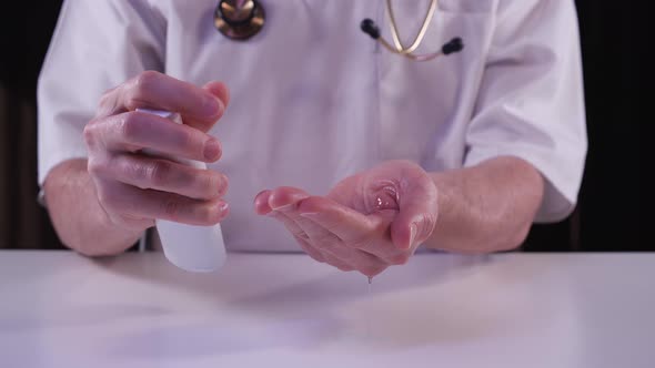 Using antibacterial hand gel. Concept: hands disinfection during coronavirus outbreak