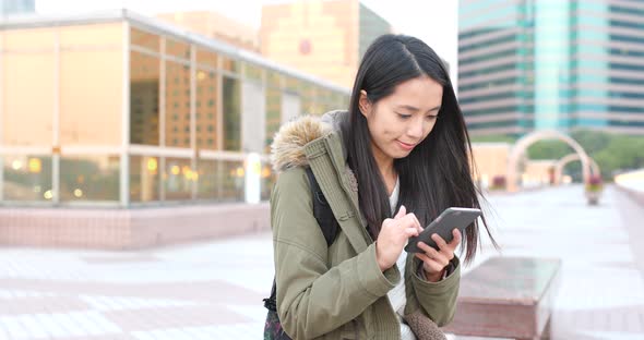 Woman use of mobile phone alt