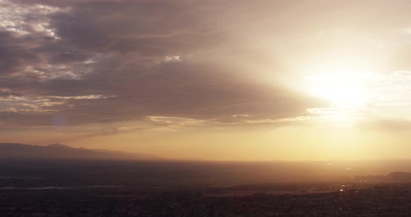 Helicopter aerial shot zooming out of motor boat on ocean, foggy day alt