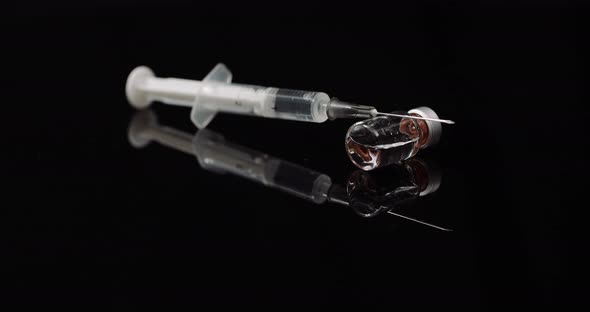 Syringe and Medicine on Black Background Isolated alt