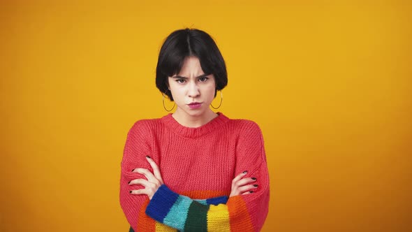 Young Grumpy Lady Crossing Hands Feeling Offended and Unhappy Orange Background alt