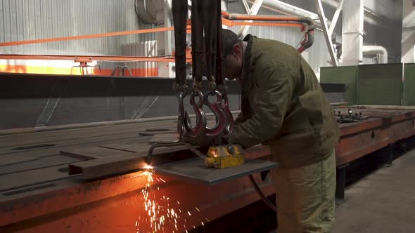 Manual Metal Cutting, Spark Flow and Flame Torch. Industrial Production. Protective Masked Welder alt