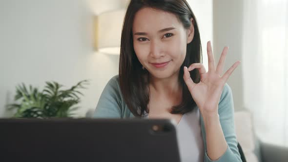 Beautiful Asian Woman Saying Ok or Perfect by Finger Sign