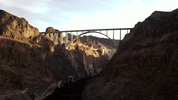 4K Aerial View of Hoover Dam and Colorado River Bypass Bridge from down in the Colorado River gorge alt