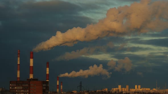 Seamless Cinemagraph Smoke From Pipes in the Air. Large Pipes of Industrial Factory Produce Chemical