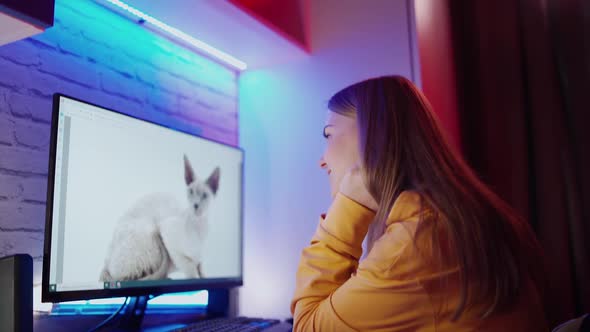 Woman using computer work at home. Happy young beautiful woman using computer indoors alt