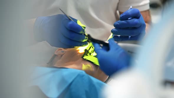 Dentist Surgeon Install Dental Implant Teeth