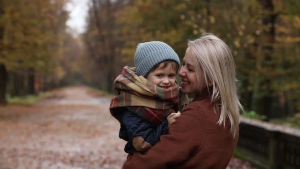 Mother and son in an autumn park