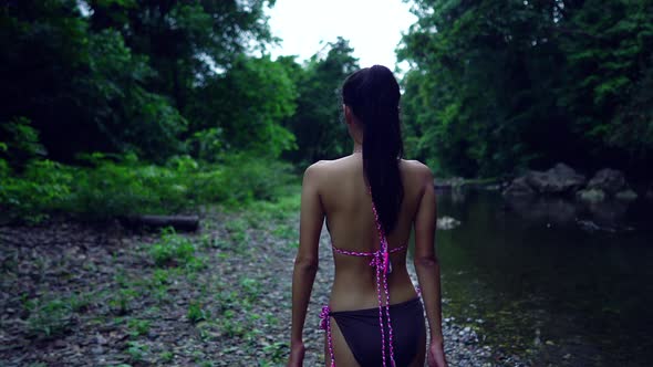 Cute Asian Girl in Bikini Walking in the River Thailand
