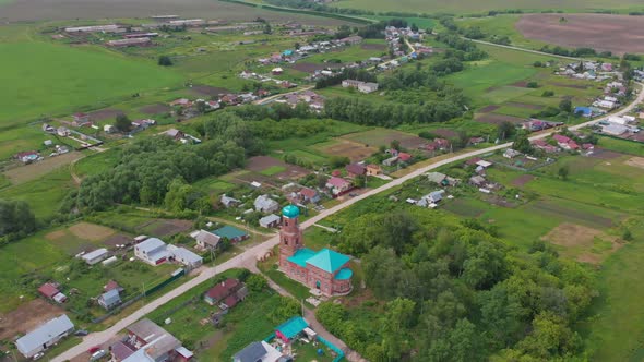 Green Field and Small Villages with Cultivation Fields alt