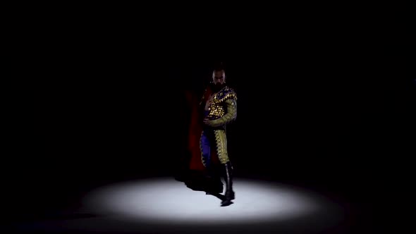 Torero in Blue and Gold Suit or Typical Spanish Bullfighter Isolated Spotlight on a Black Background alt