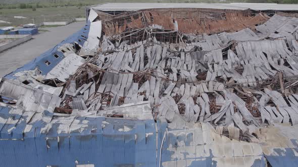 War in Ukraine Destroyed Warehouse in Bucha alt