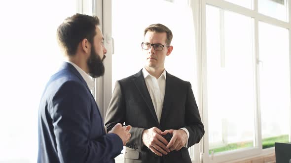 Two Successful Confident Business Men Have Conversation