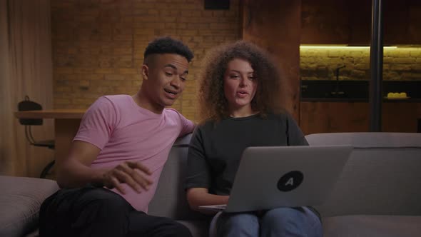 Young Mixed Race Family Showing Pregnancy Test By Video Call on Laptop alt