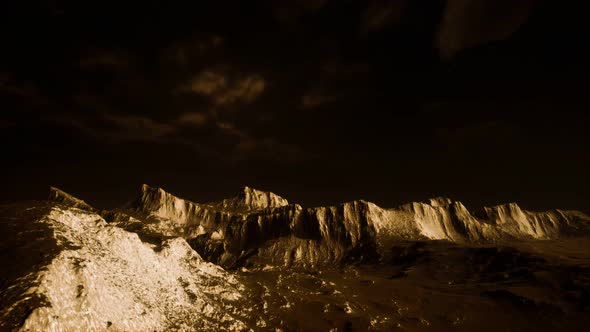 Dark Clouds Over Volcanic Valley with Grass and Rocks alt