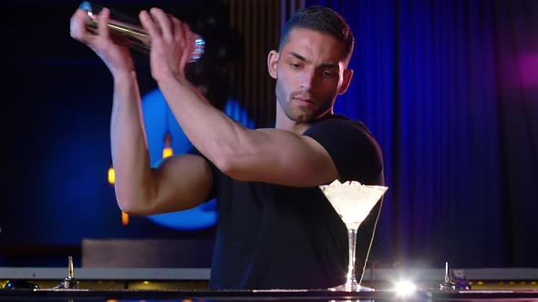 Attractive Male Bartender Mixing Night Cocktails By the Bar alt