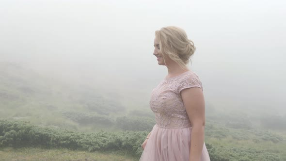 Elegant woman walking on a cloudy day alt