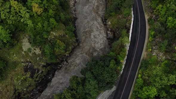 Road in the forest from the air. alt