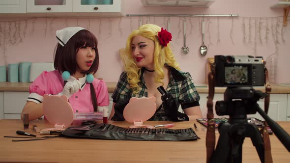 Pretty Multicultural Cosplayers Vloggers Recording Beauty Blog on Video Camera alt