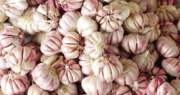 Organic Grown Garlic Display On Vegetable Boxes In Market. - High Angle, Orbiting alt